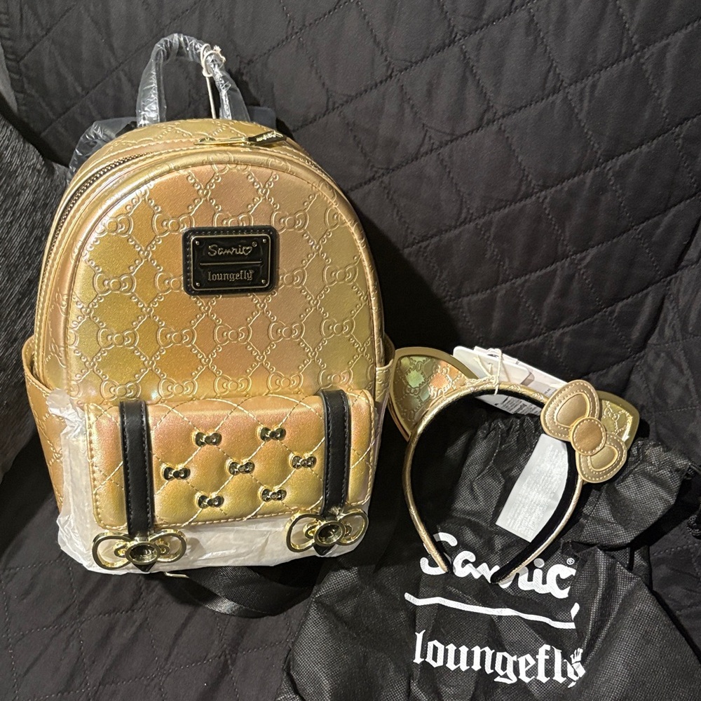 Hello kitty 50th Gold anniversary Loungefly mini backpack with matching ears.